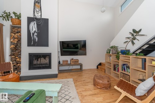 12211 42A Avenue, Edmonton, AB - Indoor Photo Showing Living Room With Fireplace