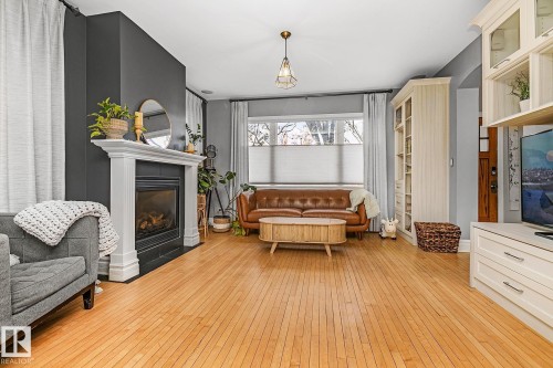10823 125 Street, Edmonton, AB - Indoor Photo Showing Living Room With Fireplace