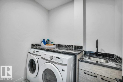 560 Stout Bend, Leduc, AB - Indoor Photo Showing Laundry Room