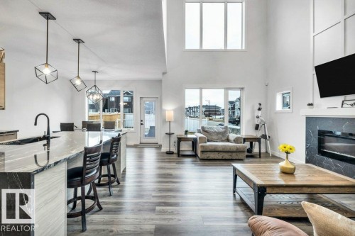 560 Stout Bend, Leduc, AB - Indoor Photo Showing Living Room With Fireplace