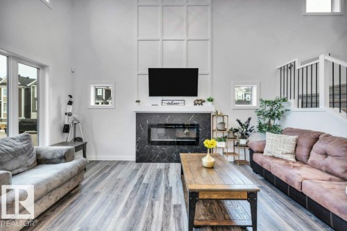 560 Stout Bend, Leduc, AB - Indoor Photo Showing Living Room With Fireplace