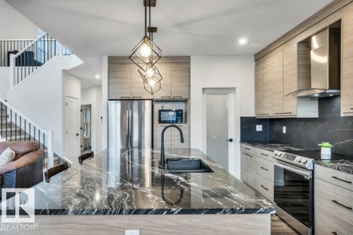 560 Stout Bend, Leduc, AB - Indoor Photo Showing Kitchen With Upgraded Kitchen
