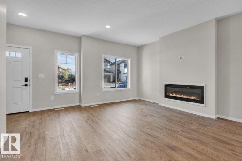 10 Hunter Place, Spruce Grove, AB - Indoor Photo Showing Living Room With Fireplace