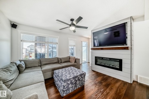 1077 Cy Becker Road, Edmonton, AB - Indoor Photo Showing Living Room With Fireplace