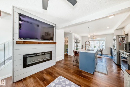 1077 Cy Becker Road, Edmonton, AB - Indoor Photo Showing Living Room With Fireplace