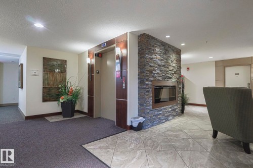 116 4450 Mccrae Avenue Nw, Edmonton, AB - Indoor With Fireplace