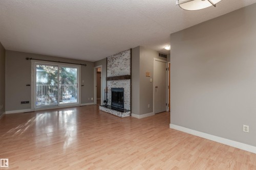208 22 Alpine Place, St. Albert, AB - Indoor Photo Showing Living Room With Fireplace
