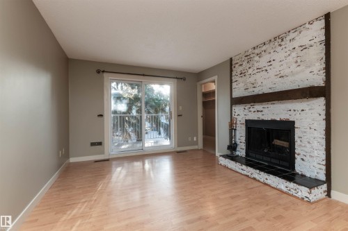 208 22 Alpine Place, St. Albert, AB - Indoor Photo Showing Living Room With Fireplace