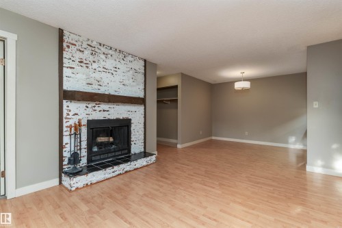 208 22 Alpine Place, St. Albert, AB - Indoor Photo Showing Living Room With Fireplace