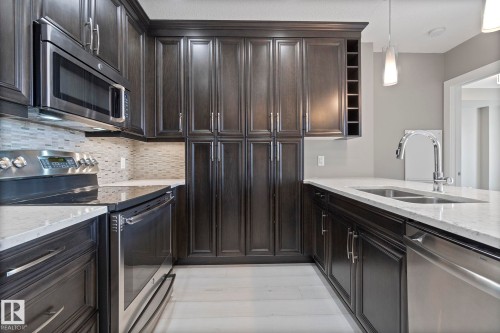 213 11080 Ellerslie Road, Edmonton, AB - Indoor Photo Showing Kitchen With Double Sink With Upgraded Kitchen
