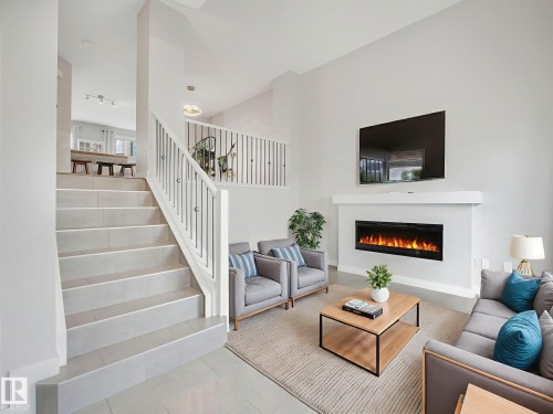 11 4470 Prowse Road, Edmonton, AB - Indoor Photo Showing Living Room With Fireplace