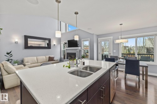 17504 13 Avenue, Edmonton, AB - Indoor Photo Showing Kitchen With Fireplace With Double Sink