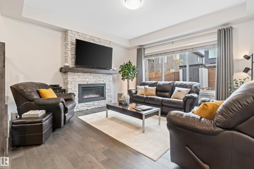 2140 Koshal Way, Edmonton, AB - Indoor Photo Showing Living Room With Fireplace