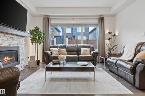2140 Koshal Way, Edmonton, AB - Indoor Photo Showing Living Room With Fireplace