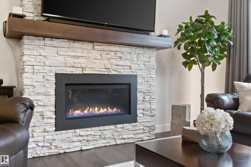 2140 Koshal Way, Edmonton, AB - Indoor Photo Showing Living Room With Fireplace