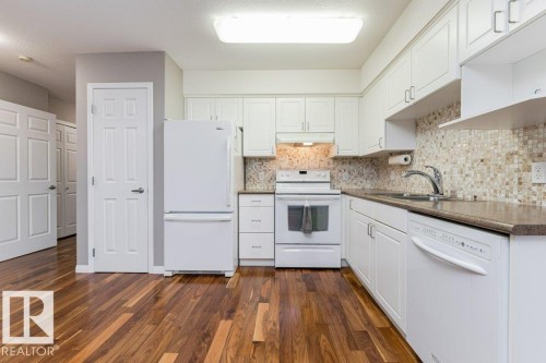 208 8802 Southfort Drive, Fort Saskatchewan, AB - Indoor Photo Showing Kitchen With Double Sink