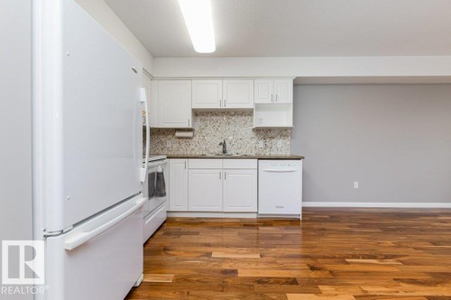 208 8802 Southfort Drive, Fort Saskatchewan, AB - Indoor Photo Showing Kitchen
