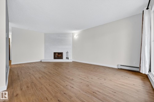 204 10829 117 Street, Edmonton, AB - Indoor With Fireplace