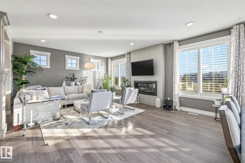 4210 Veterans Way, Edmonton, AB - Indoor Photo Showing Living Room With Fireplace