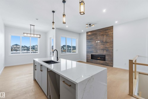 72 Eldridge Point(E), St. Albert, AB - Indoor Photo Showing Kitchen With Fireplace With Double Sink With Upgraded Kitchen