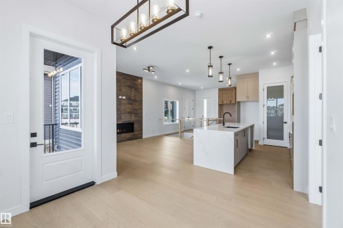 72 Eldridge Point(E), St. Albert, AB - Indoor Photo Showing Kitchen With Fireplace