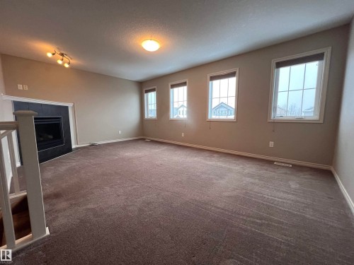 1117 59A Street, Edmonton, AB - Indoor Photo Showing Other Room With Fireplace