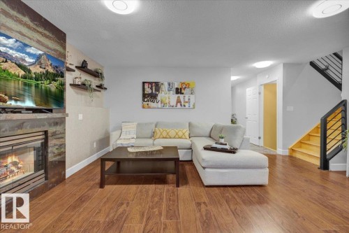 1144 Wedgewood Boulevard, Edmonton, AB - Indoor Photo Showing Living Room With Fireplace