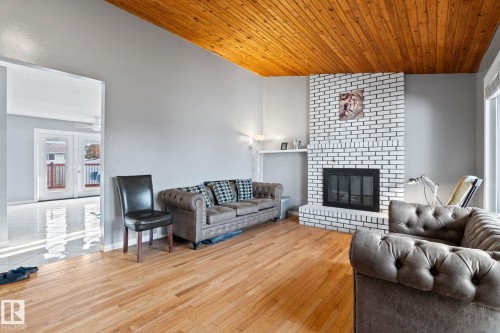 4828 17 Ave, Edmonton, AB - Indoor Photo Showing Living Room With Fireplace