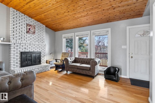 4828 17 Ave, Edmonton, AB - Indoor Photo Showing Living Room With Fireplace