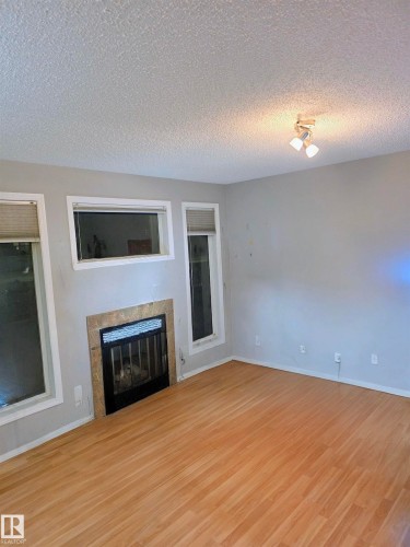 11 6304 Sandin Way, Edmonton, AB - Indoor With Fireplace