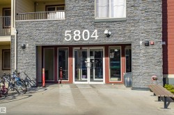 Property entrance with stone siding, french doors, and a patio area - 
