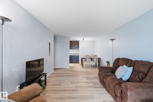408 10511 19 Avenue, Edmonton, AB - Indoor Photo Showing Living Room With Fireplace
