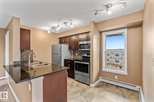 401 5370 Chappelle Road, Edmonton, AB - Indoor Photo Showing Kitchen With Double Sink