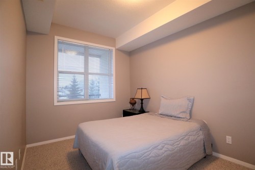 200 9940 Sherridon Drive, Fort Saskatchewan, AB - Indoor Photo Showing Bedroom