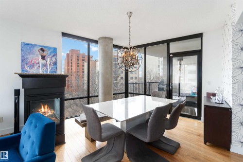 504 10028 119 Street, Edmonton, AB - Indoor Photo Showing Dining Room With Fireplace
