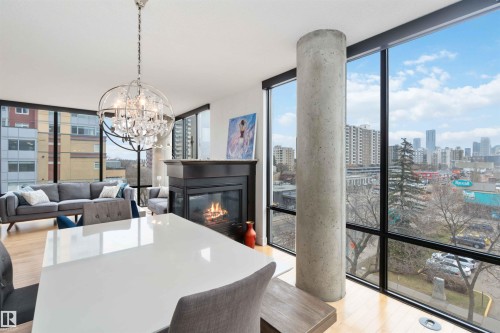 504 10028 119 Street, Edmonton, AB - Indoor Photo Showing Dining Room With Fireplace
