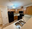 118 7801 Golf Course Road, Stony Plain, AB  - Indoor Photo Showing Kitchen With Double Sink 