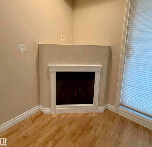 118 7801 Golf Course Road, Stony Plain, AB - Indoor With Fireplace