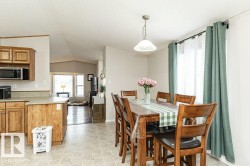 Dining room featuring lofted ceiling and a textured ceiling - 