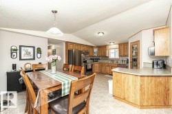 Dining room featuring a textured ceiling and lofted ceiling - 