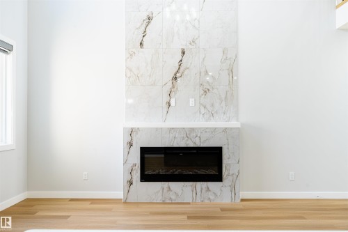 24 Norwyck Way, Spruce Grove, AB - Indoor Photo Showing Living Room With Fireplace