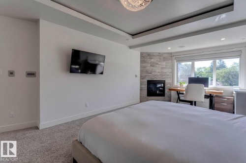 14643 92A Avenue, Edmonton, AB - Indoor Photo Showing Bedroom With Fireplace