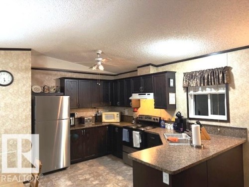 140 Willow Park Estates, Leduc, AB - Indoor Photo Showing Kitchen With Double Sink