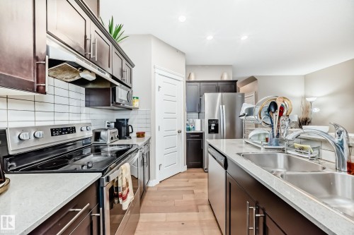 246 Hawks Ridge Boulevard, Edmonton, AB - Indoor Photo Showing Kitchen With Stainless Steel Kitchen With Double Sink With Upgraded Kitchen
