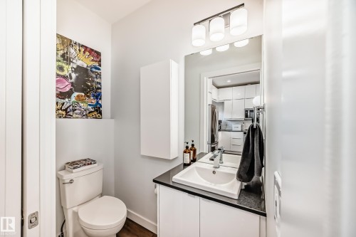 Bathroom with vanity and dark wood finished floors - 14812 98 Avenue, Edmonton, AB - Indoor Photo Showing Bathroom