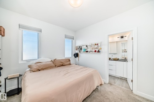 Bedroom featuring light colored carpet and baseboards - 14812 98 Avenue, Edmonton, AB - Indoor Photo Showing Bedroom