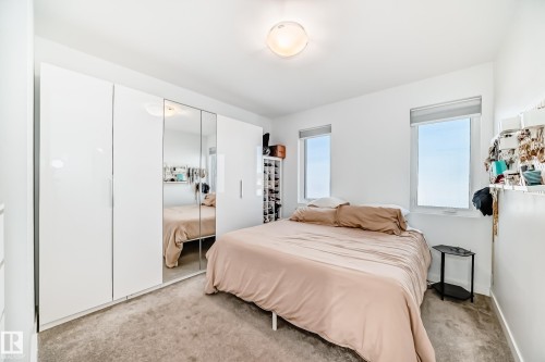 Bedroom featuring light carpet and a closet - 14812 98 Avenue, Edmonton, AB - Indoor Photo Showing Bedroom