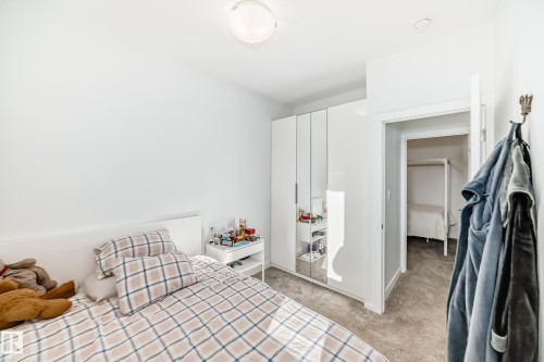 Bedroom featuring light carpet - 14812 98 Avenue, Edmonton, AB - Indoor