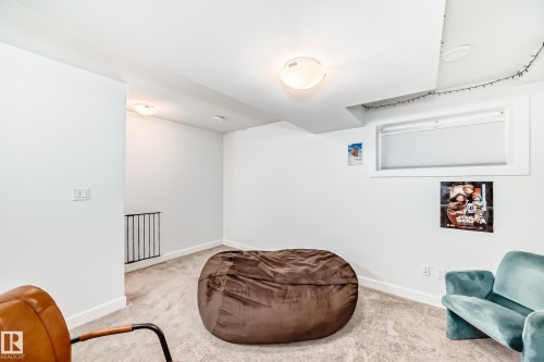 Living area with light colored carpet and baseboards - 14812 98 Avenue, Edmonton, AB - Indoor