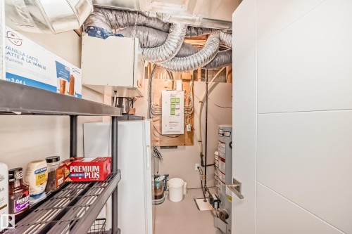 Utilities with water heater - 14812 98 Avenue, Edmonton, AB - Indoor Photo Showing Basement